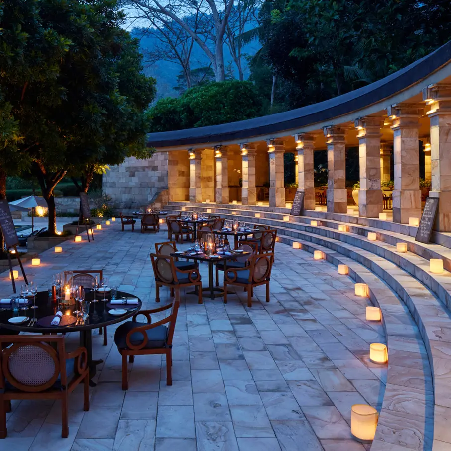 A candlelit colonnade at dusk