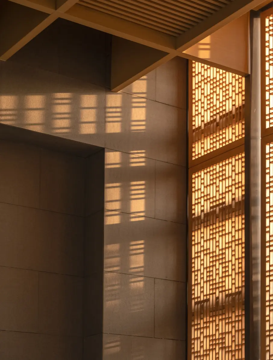 Abstract light and shadow through a timber screen
