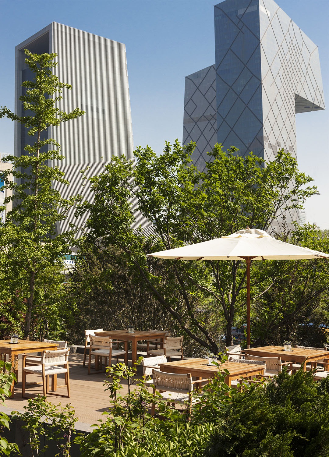 A rooftop terrace against a city skyline
